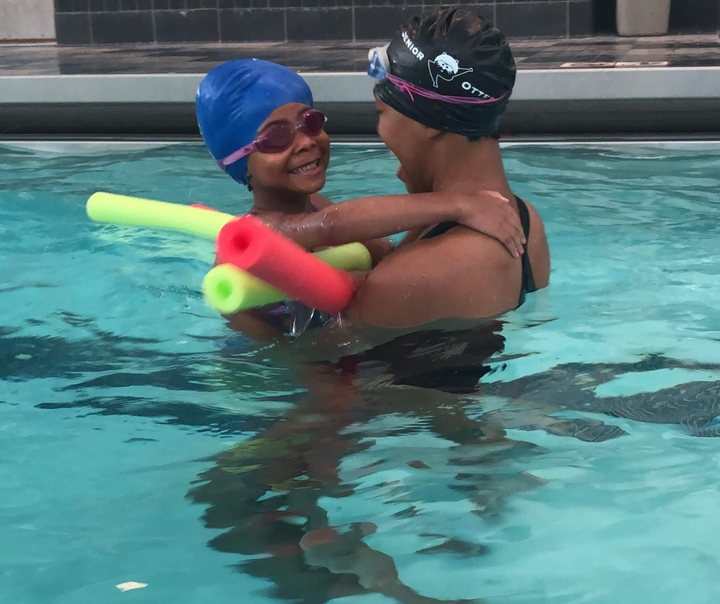 Ayanna and her daughter in a pool